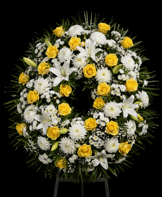 Coronas funerarias con rosas blancas y amarillas